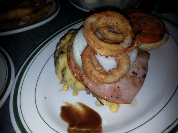 The crowning of a New Yorker Burger at Jackson Hole.