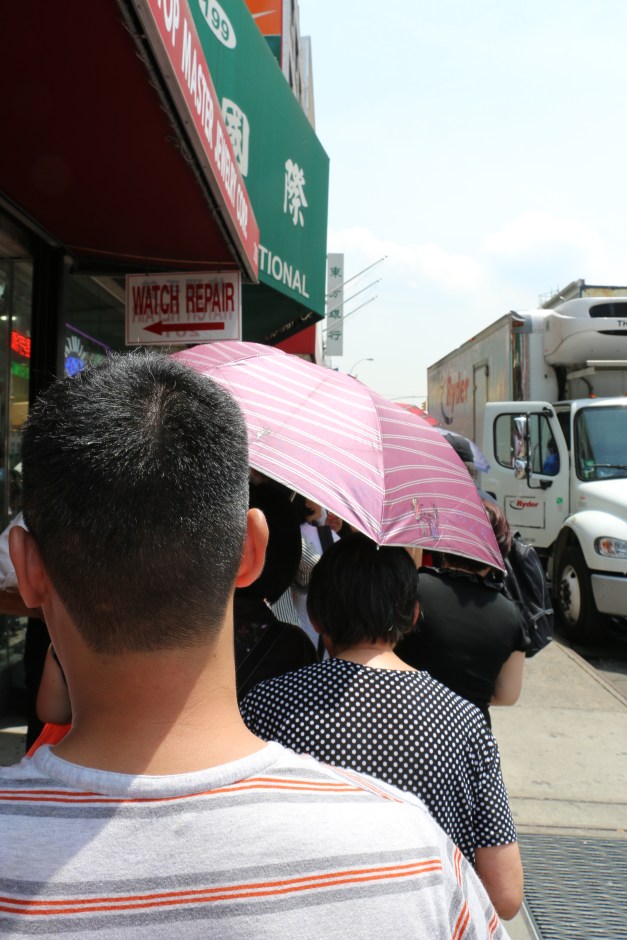 On line for Greek Yogurt in the Hot Sun
