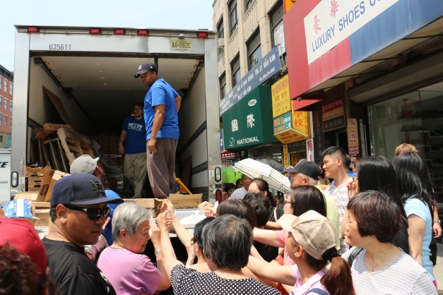 This crowd mobbed the sidewalk for that good yogurt.
