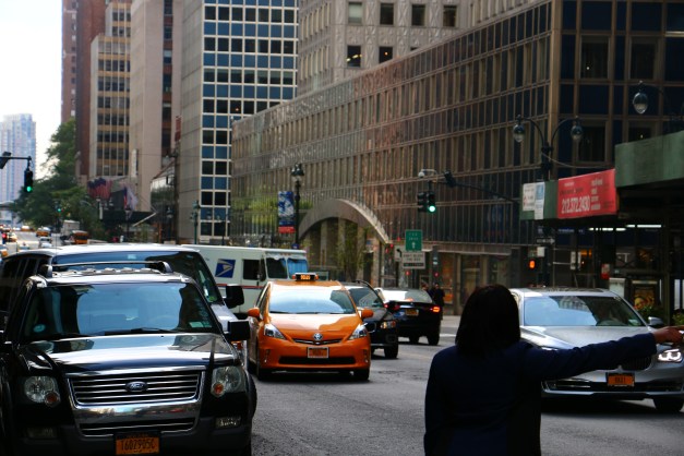 Woman Hails A Cab